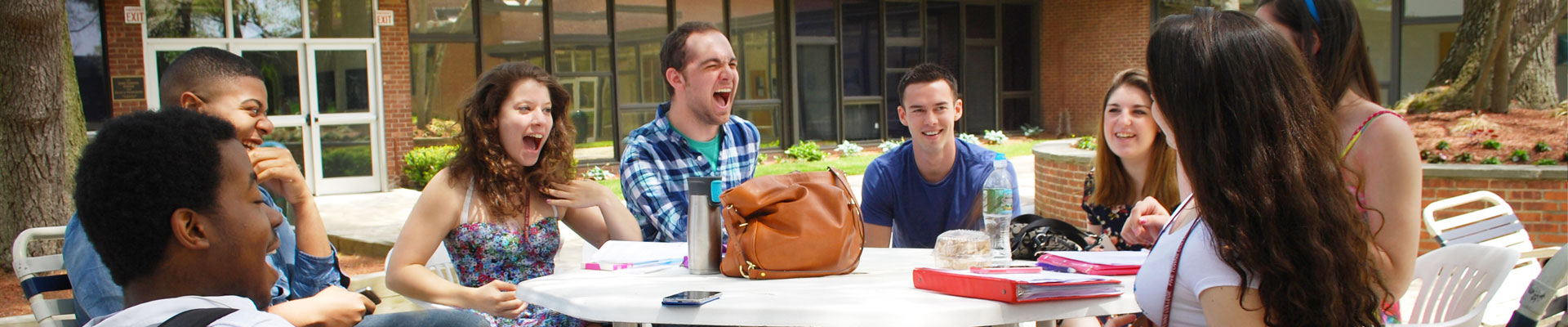 College radio broadcasting students discussing a news story